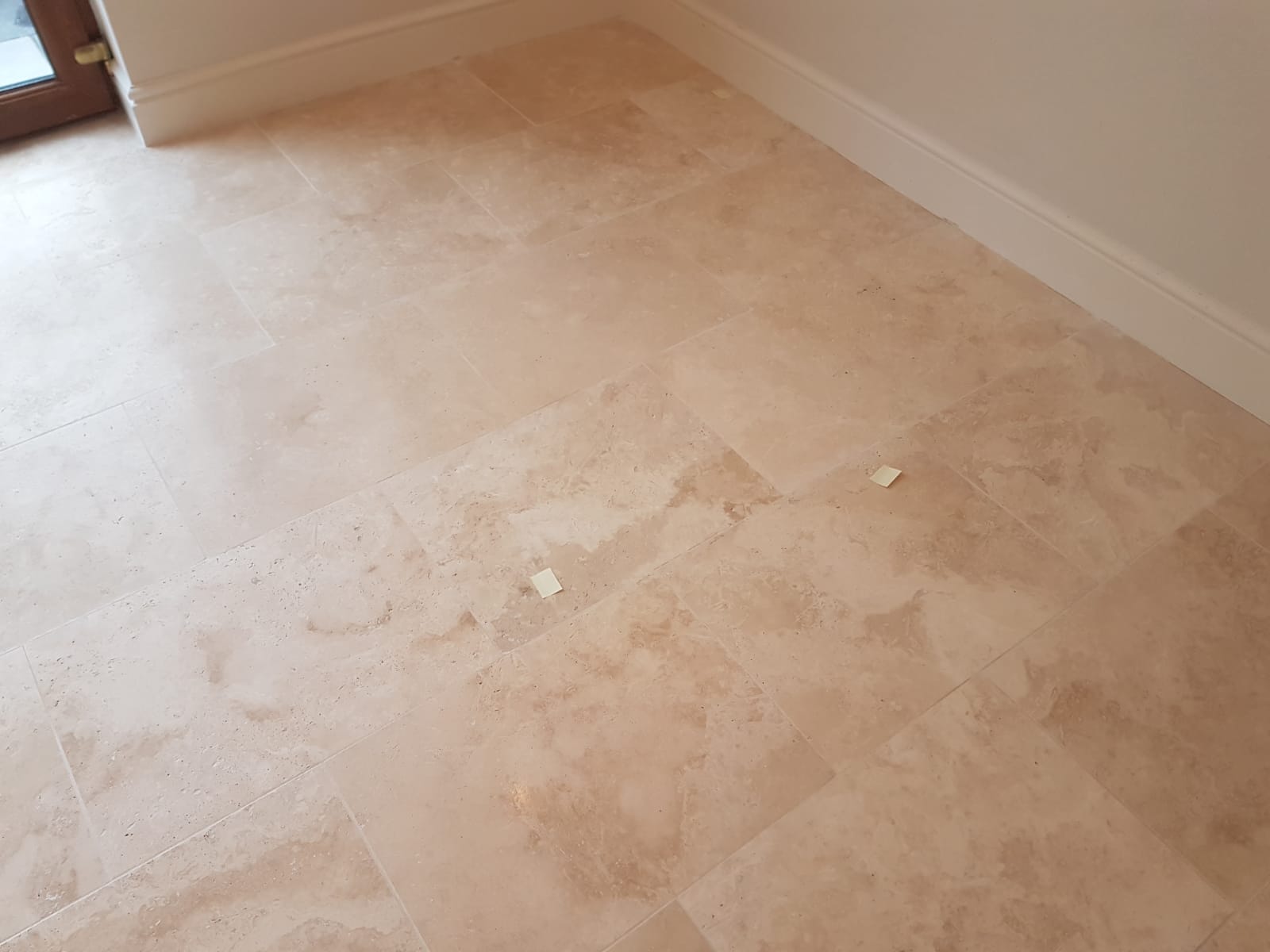 Travertine Floor with Lippage Issues Before Milling in Gower Swansea
